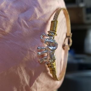 Gold bracelet with silver elephant.